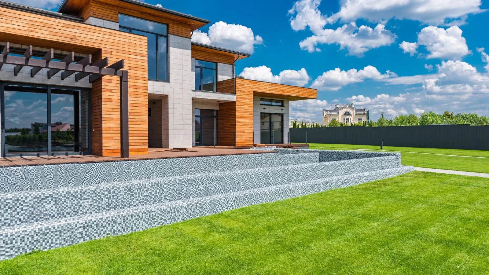 Contemporary home exterior with large fiberglass-framed windows